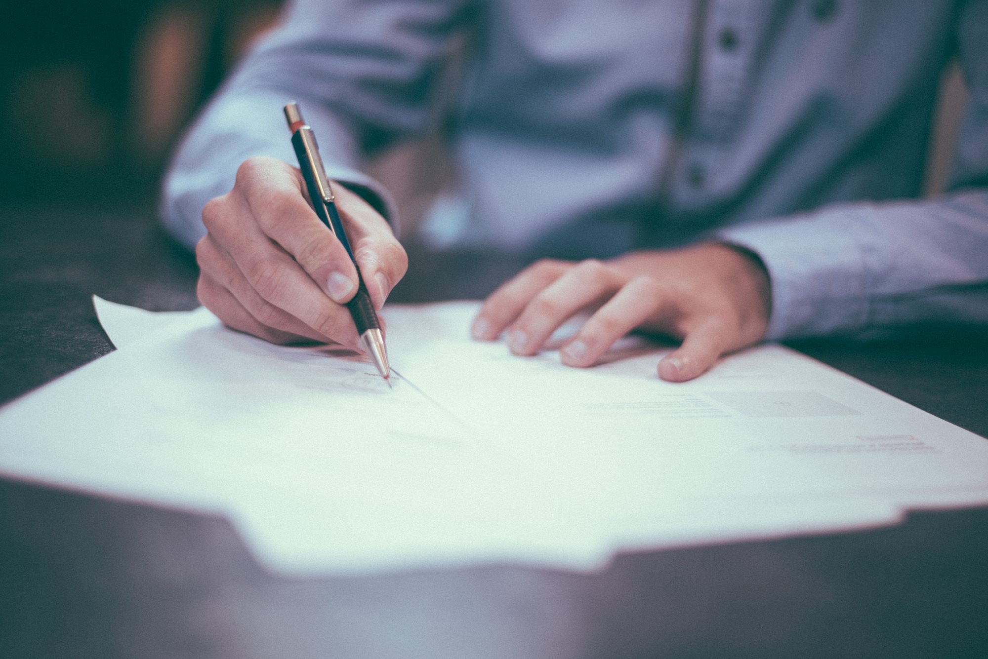 Person filling out Contract